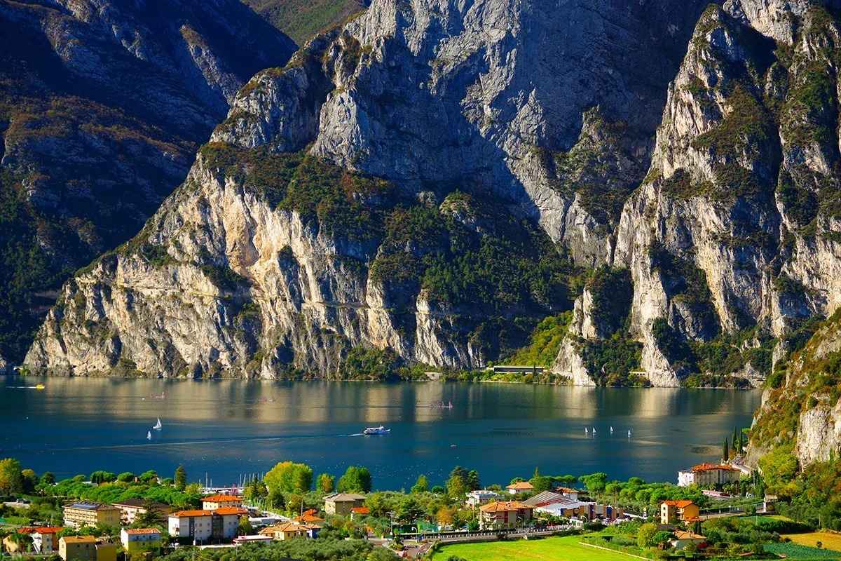 Cyclists riding along the Adige River